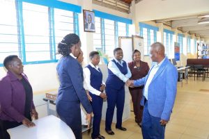 The University of Nairobi's Vice Chancellor recognizes the library staff during his visit to assess the library department's advancement as a hub for information sharing.